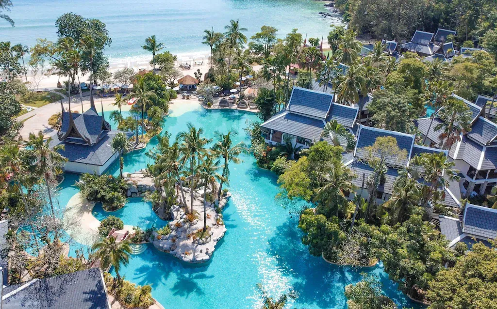 Thavorn Beach Village Resort & Spa Phuket - Aerial drone view of lagoon pool and beach villas